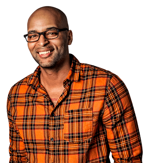 Smiling black man wearing glasses and orange checkered shirt