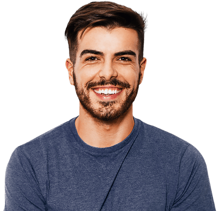 Young man with dark hair and a beard and wearing a blue t-shirt is smiling