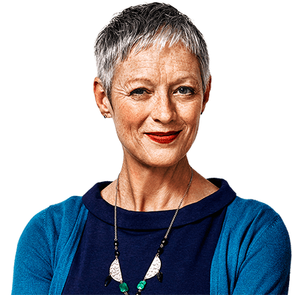 Older woman with short gray hair wearing blue sweater smiling